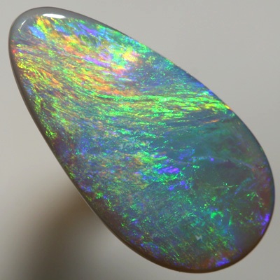 SOLID SEMI BLACK OPAL Iris pattern with gold fire. SEE VIDEO